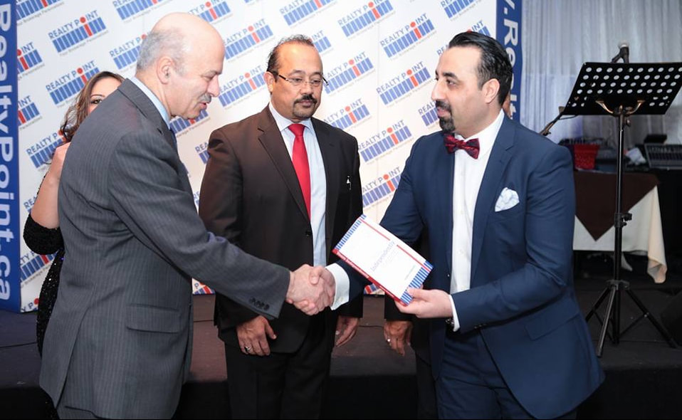 Presenting my first book, Yours Independently, to Reza Moridi, Ontario Minister of Research, Innovation and Science.